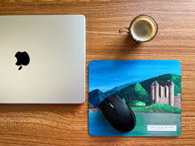 Load image into Gallery viewer, Scotland mousepad inspired in Scottish Eilean Donan castle in an office setting with a laptop and coffee