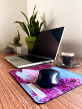 Load image into Gallery viewer, Cherry Blossom art mousepad with a mouse on a home office setting with plants and coffee
